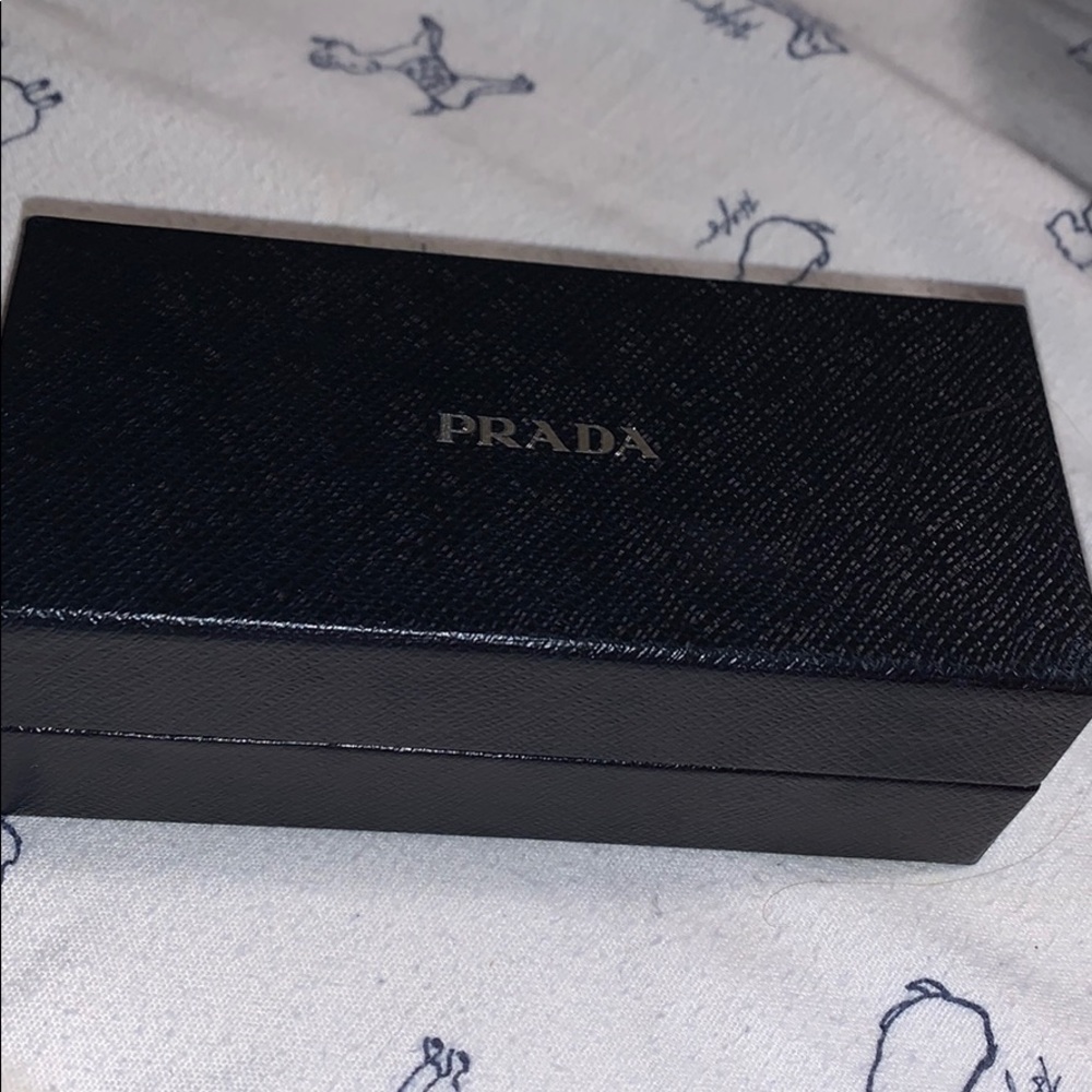 Never worn Prada sun glasses, will lower price
